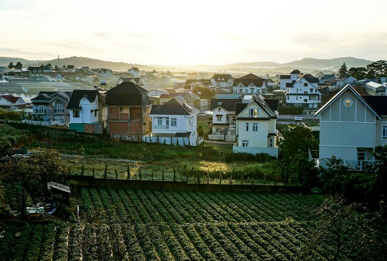 Da Lat hillside houses and farmland at sunrise