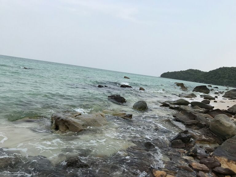 Rocky shore and turquoise sea at Sao Beach, Phu Quoc